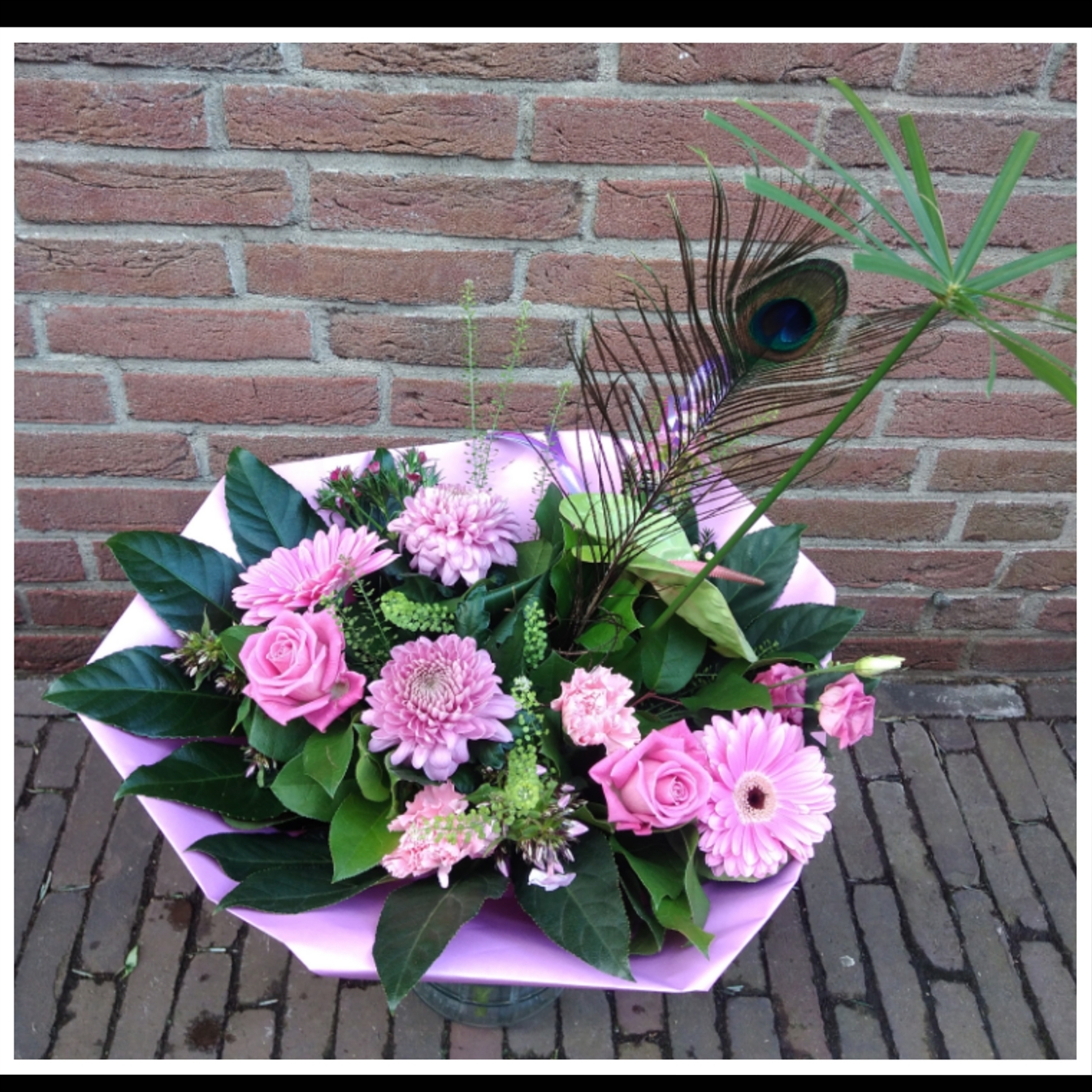 Roze boeket pauwenveer